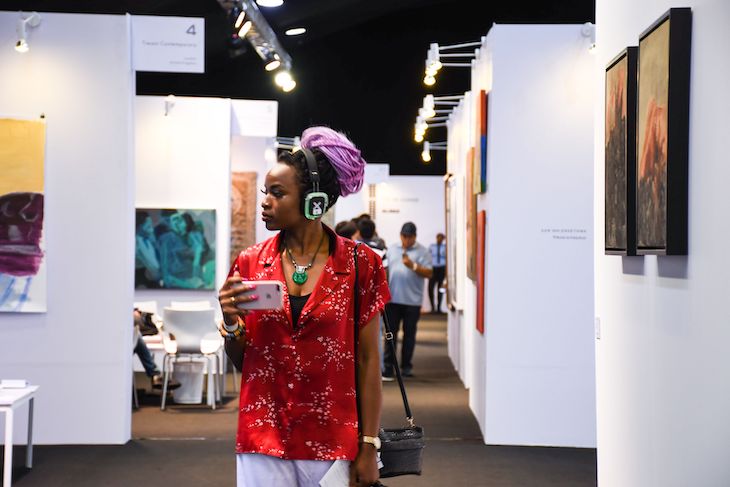 A visitor at ART X Lagos, 2019
