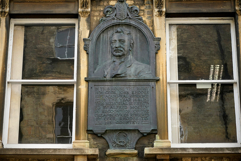 Not falling any time soon: plaque dedicated to Cecil Rhodes in King Edward Street, adjacent to Oriel College, Oxford.