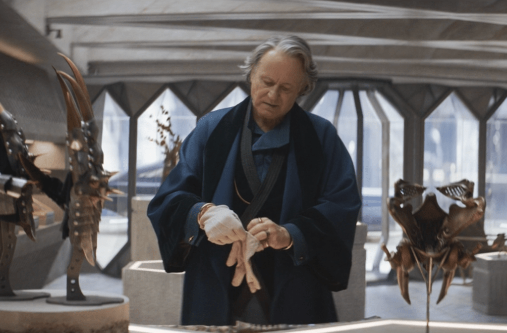 Stellan Skarsgård as antiquities dealer and spymaster in Andor. Standing in his showroom with pieces of ancient armour and jewellery