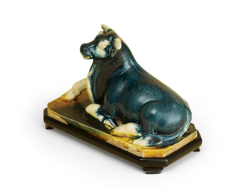 A blue straw- and amber-glazed model of a recumbent buffalo (8th century), China, Tang Dynasty. 