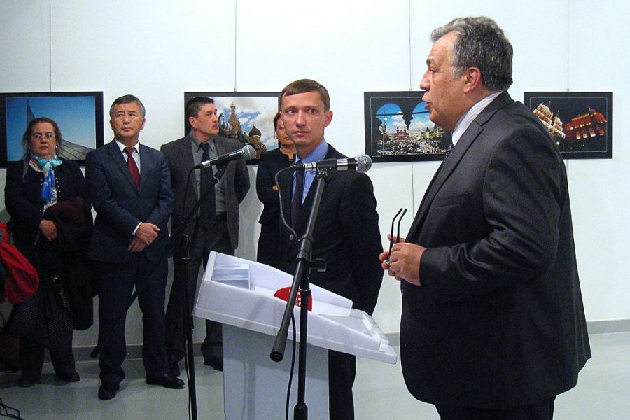 Andrei Karlov (R), the Russian ambassador to Ankara, gives a speech before being shot by a gunman (unseen) during an art exhibition in Ankara. Photo: UGUR KAVAS/AFP/Getty Images