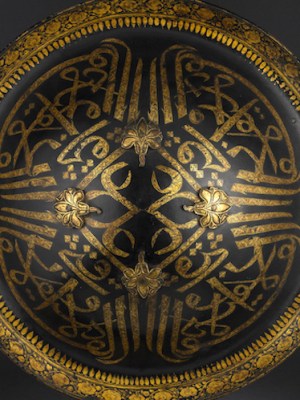 Lacquered hide shield (dhal), second half of the 18th century, India, probably Mysore, buffalo hide, gold and velvet, diam. 45cm. Peter Finer (£200,000)