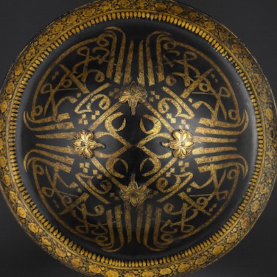 Lacquered hide shield (dhal), second half of the 18th century, India, probably Mysore, buffalo hide, gold and velvet, diam. 45cm. Peter Finer (£200,000)