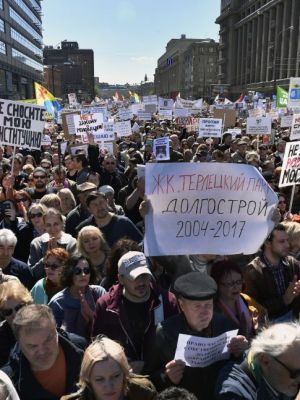 Demonstrators march during a protest in Moscow on 14 May, 2017, against the city's controversial plan to knock down Soviet-era apartment blocks and redevelop the old neighbourhoods. ALEXANDER NEMENOV/AFP/Getty Images