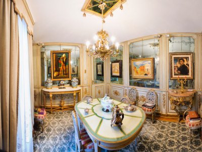 Paintings by De Chirico hang in the mirrored dining room of Francesco Federico Cerruti's villa. Photo: Gabriele Gaidano