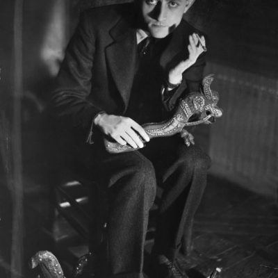 Andre Malraux holding a Khmer sculpture, Photo: © Bettmann/Getty Images