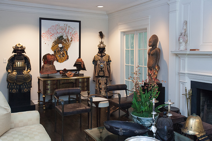 In the living room, a complete set of early Edo period dangaedo tosei gusoku armour from the 17th century (left) and a 19th-century Manchu officer's uniform flank Chinese lacquered leather Nuosu armour from the Yi culture, China, late 18th-early 19th century.