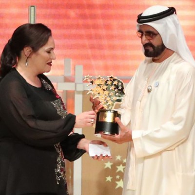 Andria Zafirakou receives the 'Global Teacher Prize' from Sheikh Mohammed bin Rashid al-Maktoum, Vice-President and Prime Minister of the UAE and Ruler of Dubai during an award ceremony in Dubai on 18 March 2018.