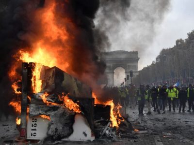 A burnt-out truck on the Champs Elysees in Paris, BERTRAND GUAY/AFP/Getty Images