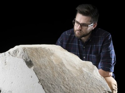 Daniel Potter, assistant curator at National Museum of Scotland, with a casing stone from the Great Pyramid of Giza.