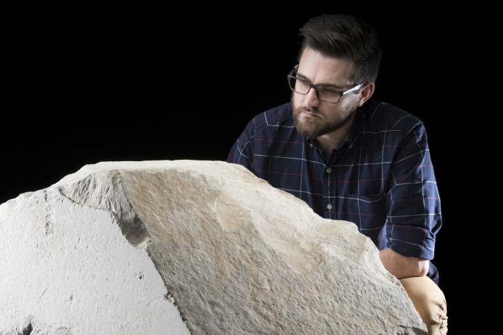 Daniel Potter, assistant curator at National Museum of Scotland, with a casing stone from the Great Pyramid of Giza.