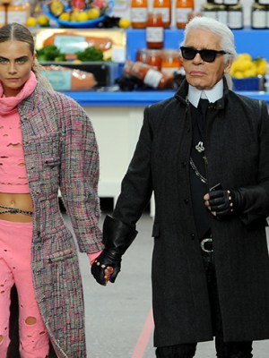 Karl Lagerfeld with Cara Delevingne during the Chanel show at Paris Fashion Week, 2014.