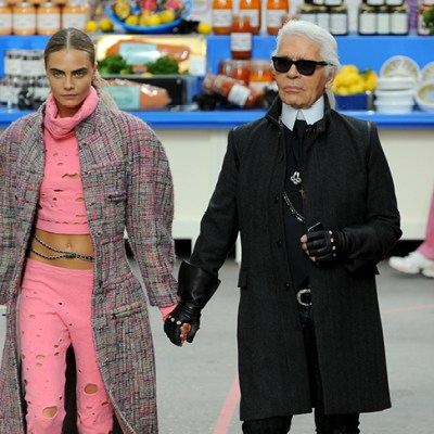 Karl Lagerfeld with Cara Delevingne during the Chanel show at Paris Fashion Week, 2014.