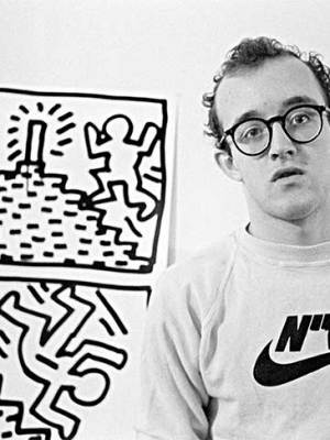 Keith Haring with one of his drawing series, photographed in January 1982 by Joseph Szkodzinski.