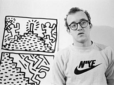 Keith Haring with one of his drawing series, photographed in January 1982 by Joseph Szkodzinski.