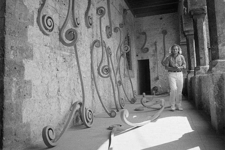 Eliseo Mattiacci with an installation of his Roma sculptures at the Palazzo Mazzancolli, Italy, in 1982.