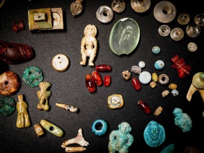 Some of the figurines and gems recently excavated in the House of the Garden at Pompeii.