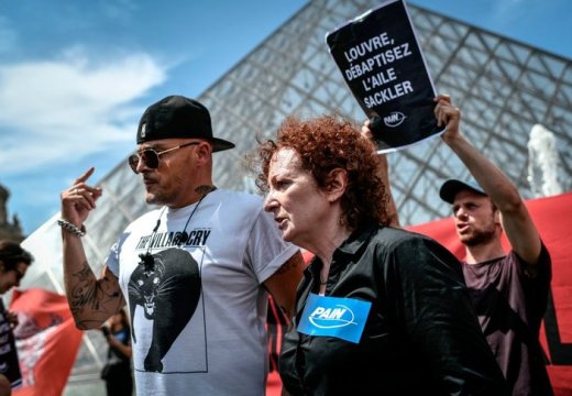 Nan Goldin at a P.A.I.N. protest in front of the Louvre in July 2019.