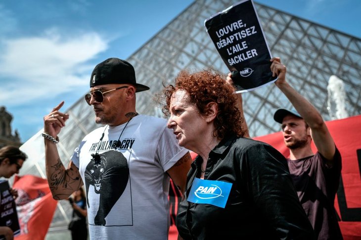 Nan Goldin at a P.A.I.N. protest in front of the Louvre in July 2019.