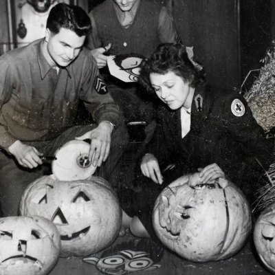 American Red Cross workers hollowing out pumpkins in preparation for a Halloween Dance at Cheltenham Town Hall in 1944.