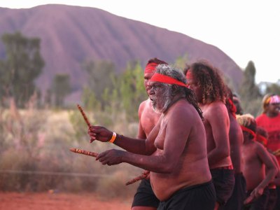 Anangu members perform a dance during a ceremony marking the permanent ban on climbing Uluru on 27 October 2019.