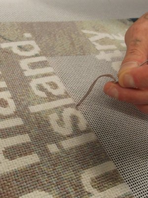 Stitchers working on Wolfgang Tillmans’ No Man is an Island (2019).