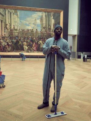 Omar Sy as Assane Diop in 'Lupin', with Veronese's 'Wedding Feast at Cana' in the background.