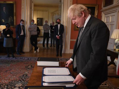 No more red tape? Boris Johnson signs the Brexit deal in December 2020.