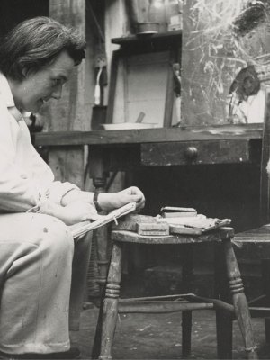 Joan Eardley sketching in her studio in Townhead, Glasgow (photo by Audrey Walker, c. 1949–51). Collection Scottish National Gallery of Modern Art