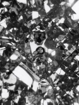 Photograph of Shigeko Kubota reflected in Three Mountains (1976–79) in her loft on Mercer Street, New York (1979), Peter Moore.