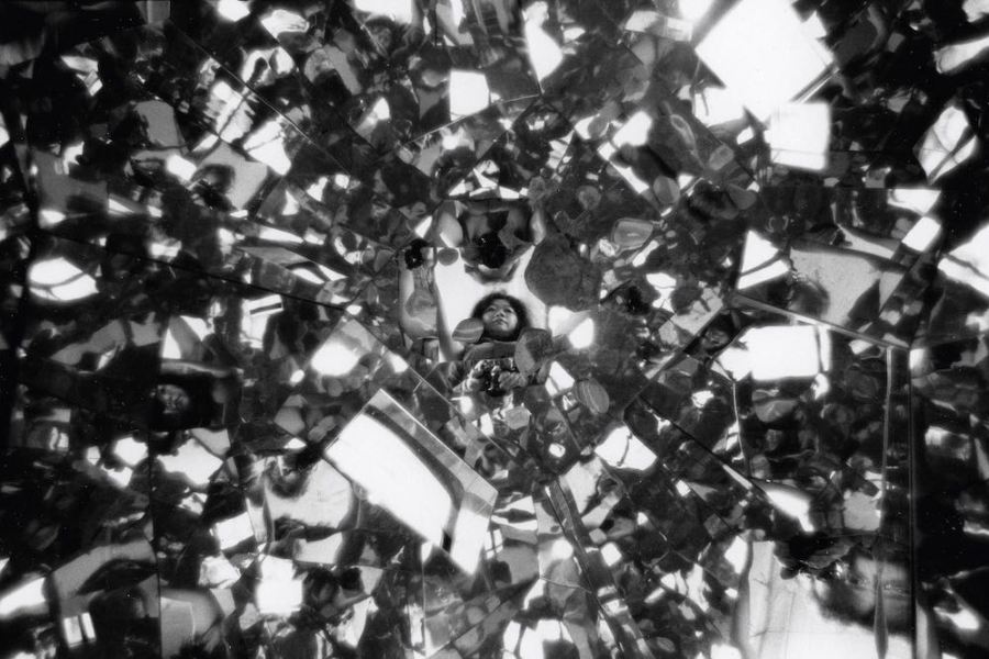 Photograph of Shigeko Kubota reflected in Three Mountains (1976–79) in her loft on Mercer Street, New York (1979), Peter Moore.