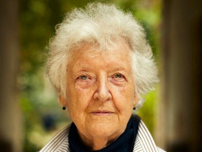 Sheila Hicks photographed in the courtyard outside her studio in Paris in August 2021.