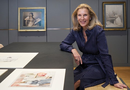 Katrin Bellinger photographed in her print room in London in May 2022. Behind her are drawings by Anne Guéret and Gjisbertus Johannus van den Berg.