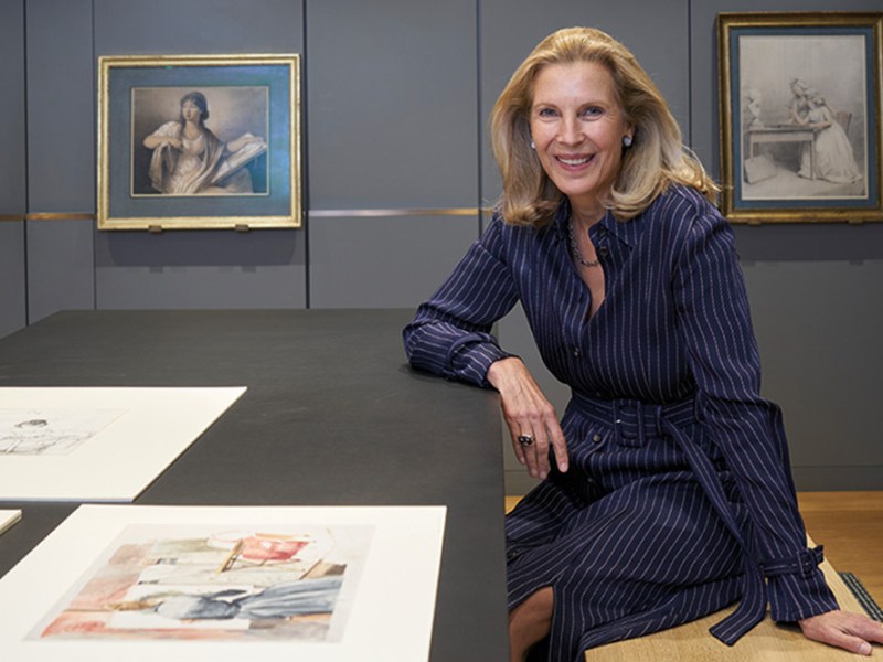 Katrin Bellinger photographed in her print room in London in May 2022. Behind her are drawings by Anne Guéret and Gjisbertus Johannus van den Berg.