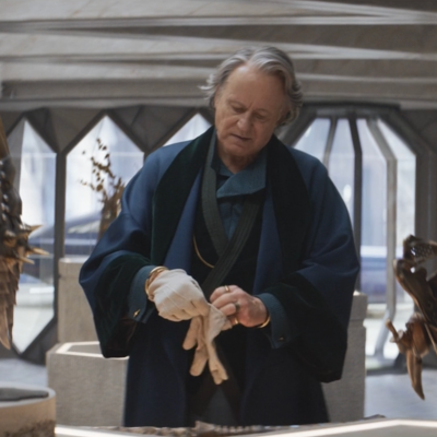 Stellan Skarsgård as antiquities dealer and spymaster in Andor. Standing in his showroom with pieces of ancient armour and jewellery